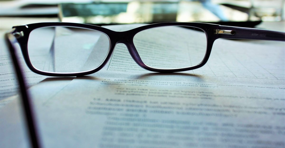 Glasses resting on contract Glasses resting on contract